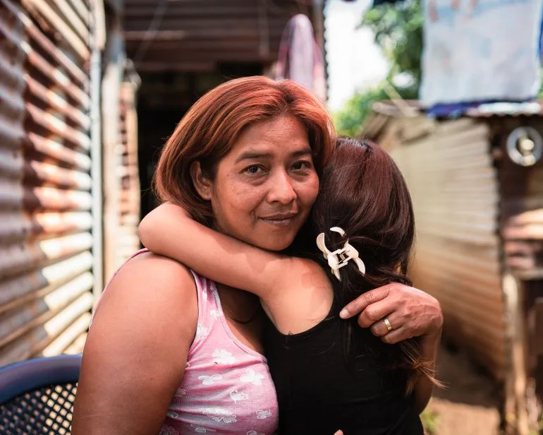Inheritance of Faith: A Salvadoran Girl's Medallion Amidst a Father's Imprisonment